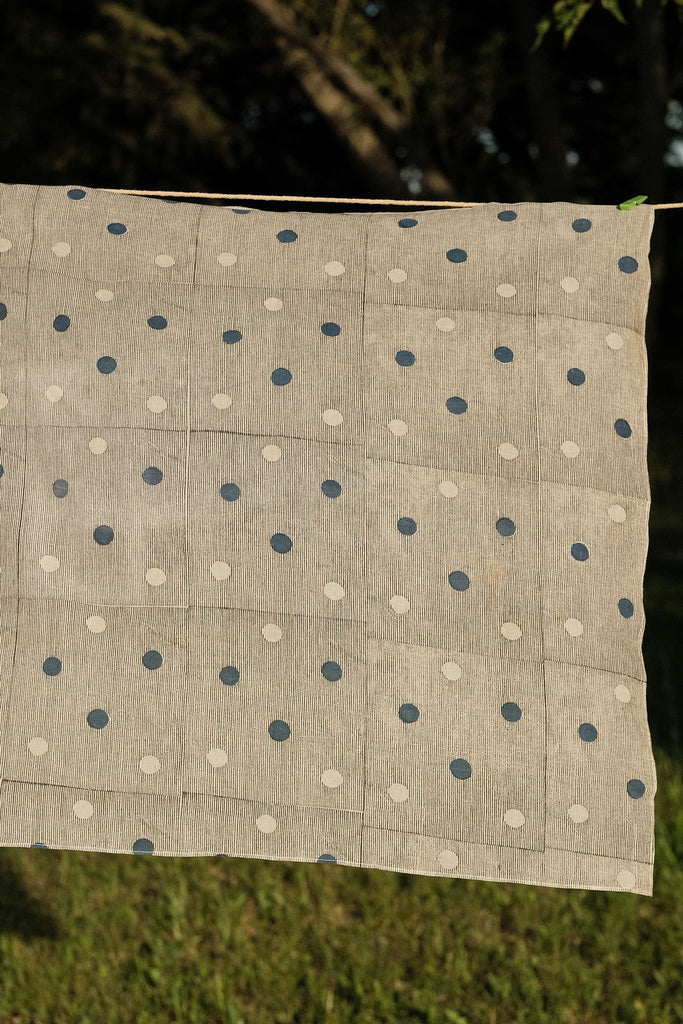 White bandana with scattered blue dot pattern by World of Crow - vintage cotton handkerchief for head wrap and styling.