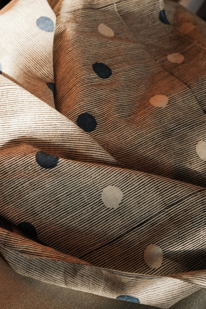 White bandana with scattered blue dot pattern by World of Crow - vintage cotton handkerchief for head wrap and styling.