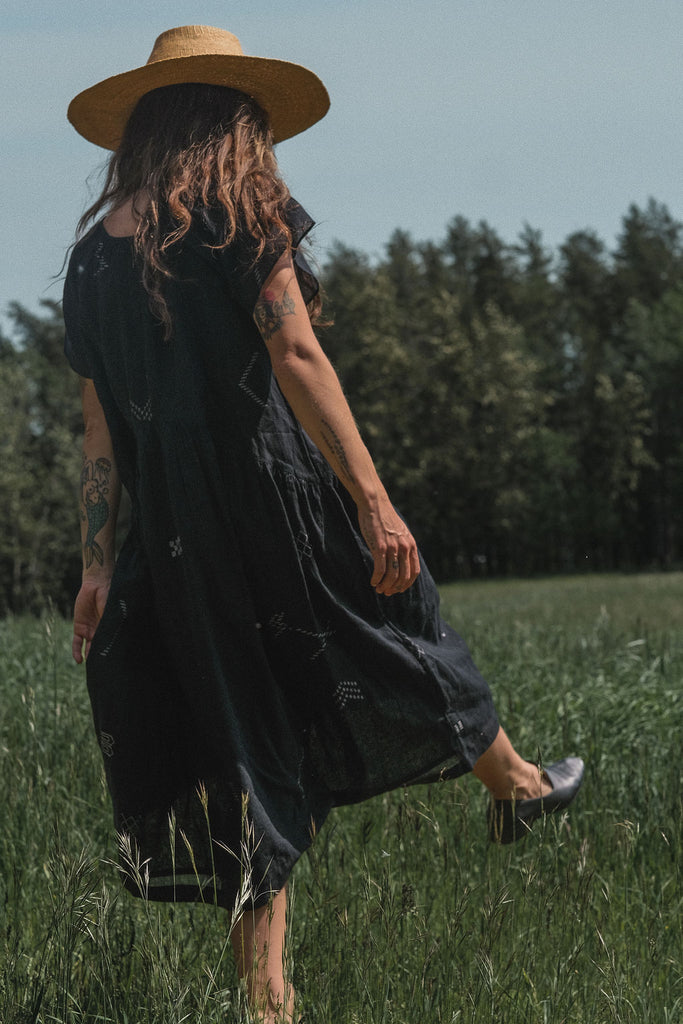 This black dress falls on the body easily. It's made with Jamdani fabric, which is soft and extremely light weight. Perfect for everyday wear. 