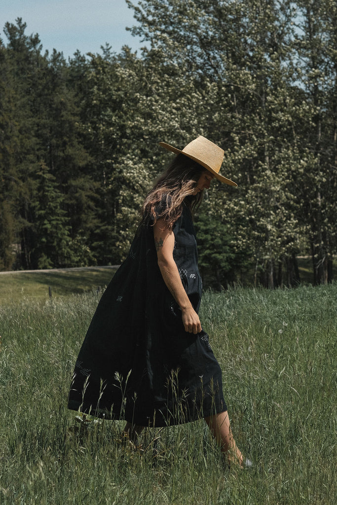 This black dress falls on the body easily. It's made with Jamdani fabric, which is soft and extremely light weight. Perfect for everyday wear. The A-line silhouette gives the charming look. A staple for your wardrobe. 