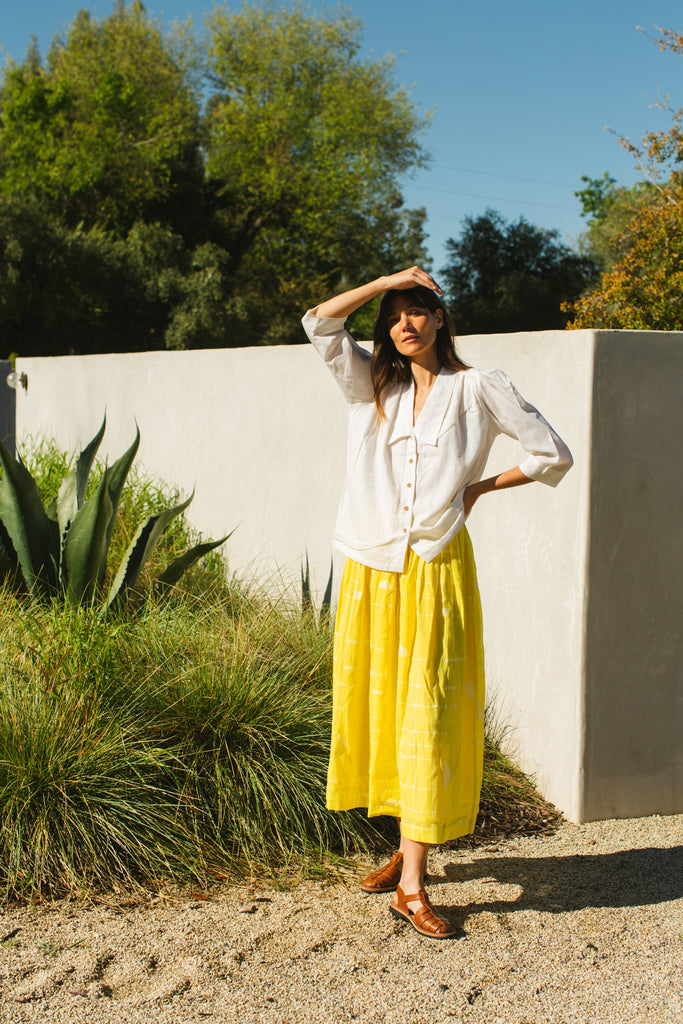 This Lemon Sorbet Skirt is made in collaboration between Erica Kim @ahistoryofarchitecture and World of Crow, it has a yellow color, checks detailing, jamdani fabric, ankle length skirt