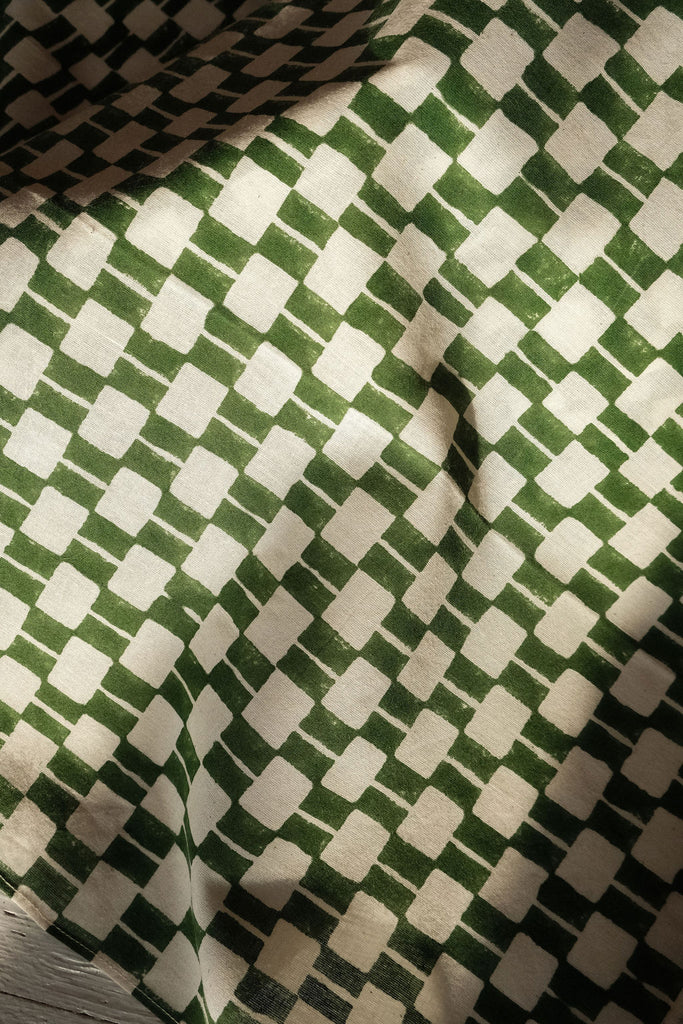 Handwoven green and white checkered cotton bandana by World of Crow, ethically crafted in India using traditional weaving techniques – sustainable and artisanal accessory for conscious fashion lovers